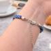 Adjustable clasp and extender chain on handmade Kumihimo bracelet, blue glass seed bead bracelet detail